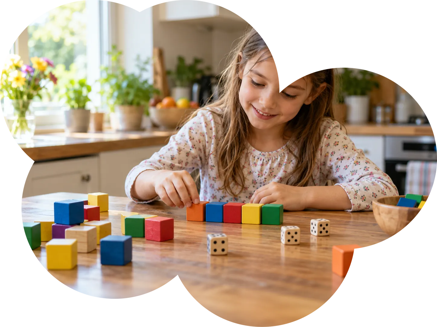 Una niña cuenta bloques de colores y dados sobre la mesa
